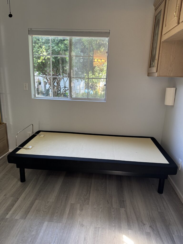 The bedroom looking to the back window. Blinds in this room are room darkening.