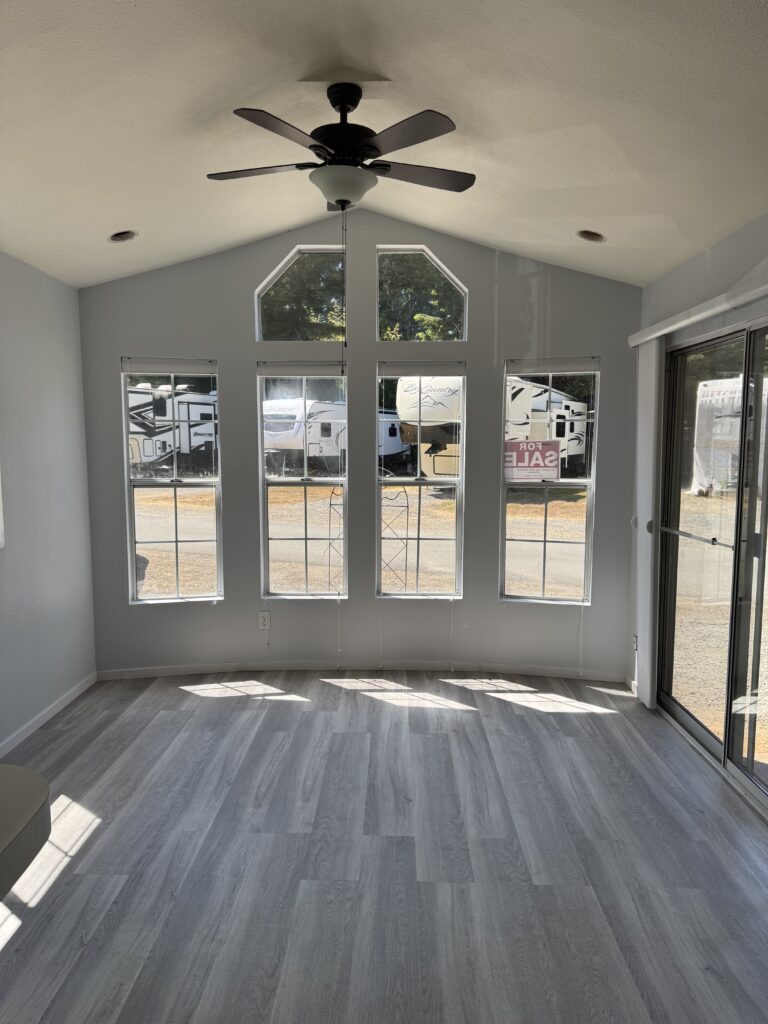 The living room. The front blinds go up or down.